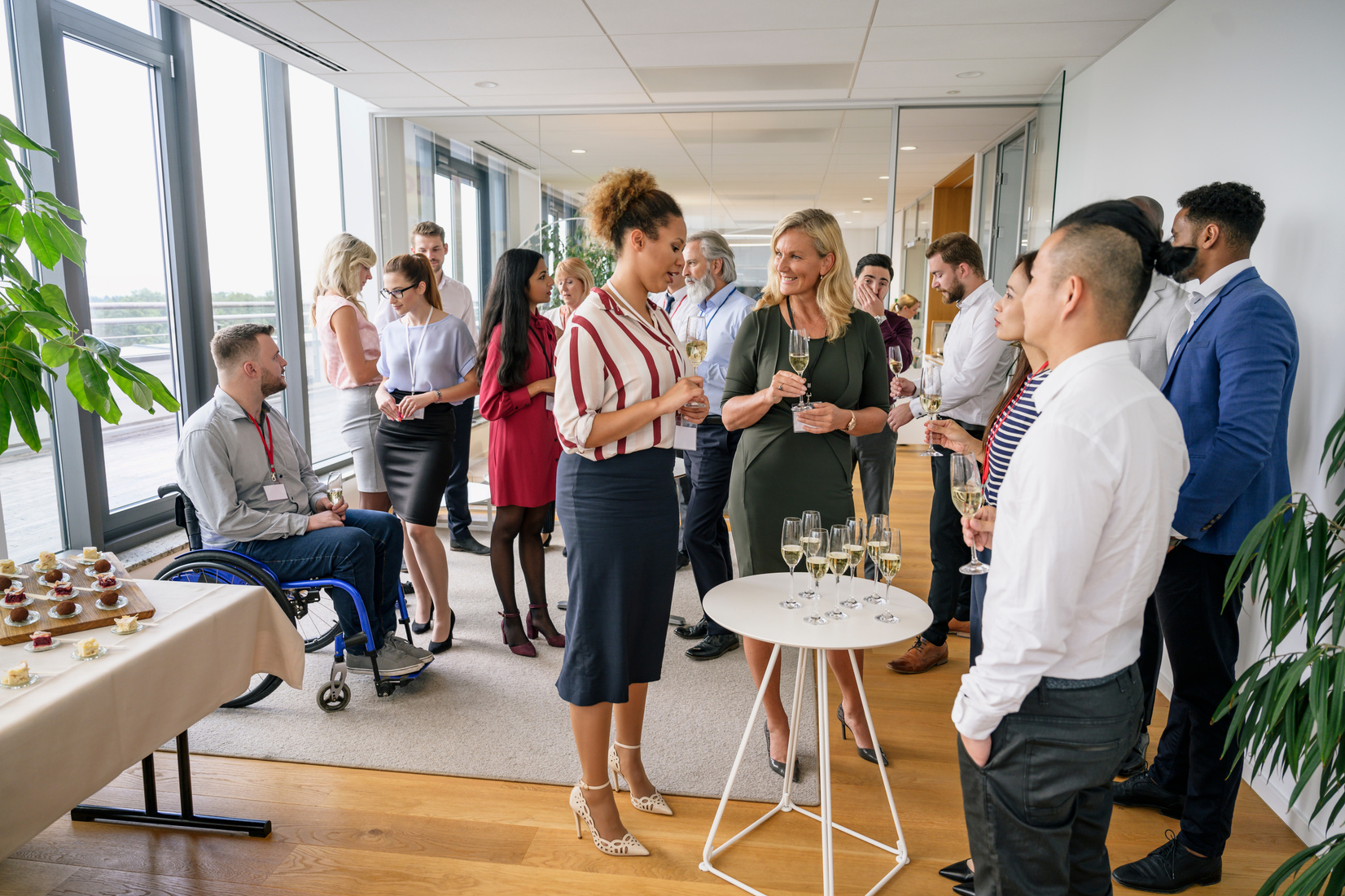 Diverse group of business people socializing at office party